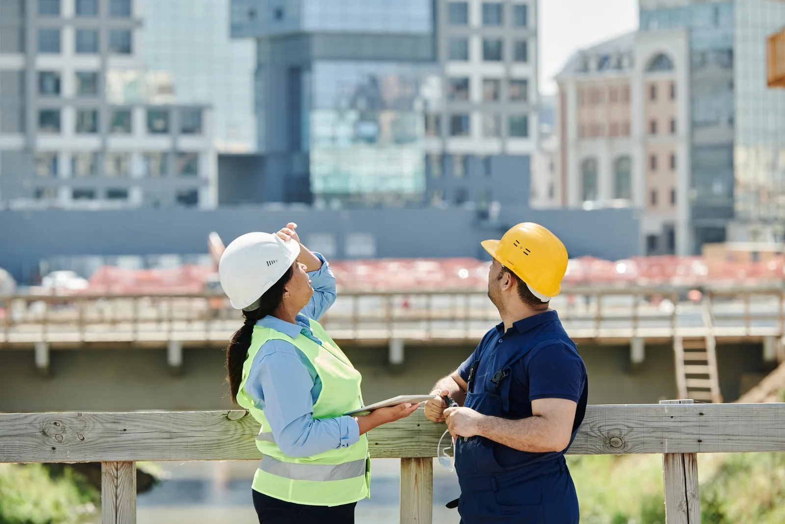 Construction professionals discussing plans on site